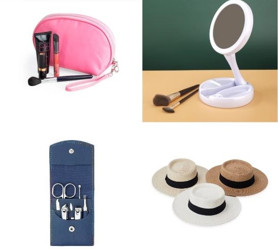 Imagem ilustrativa de uma nécessaire no canto superior esquerdo cor de rosa ao lado de alguns cosméticos e acessórios de maquiagem de cor preta, espelho dobrável na cor branca no canto superior direito com alguns pincéis de cor preto com dourado. No canto inferior esquerdo um kit de manicure com a case de azul marinho, e com as ferramentas em cor cromado. E no canto inferior direito três chapéus um branco, um beje, e marrom escuro. Todos com uma faixa preta no encaixe da cabeça no lado de fora.